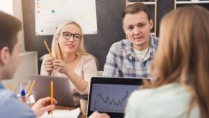 digital marketing team reviewing results at meeting