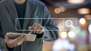 man using tablet with search bar overlaid onto image